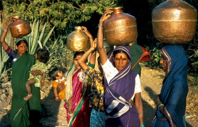 Women carrying water on heads