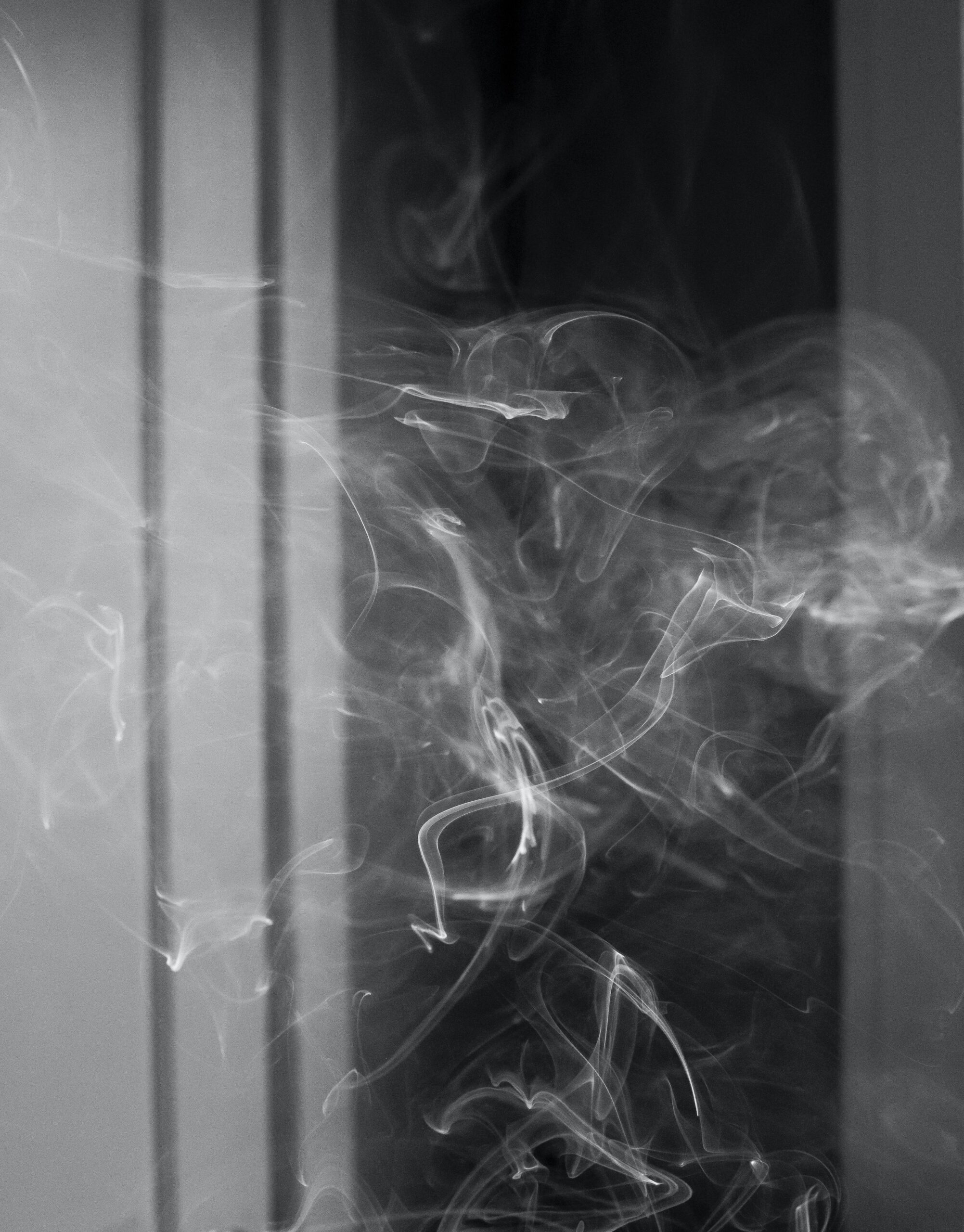 Photo of cigarette smoke hanging in the air